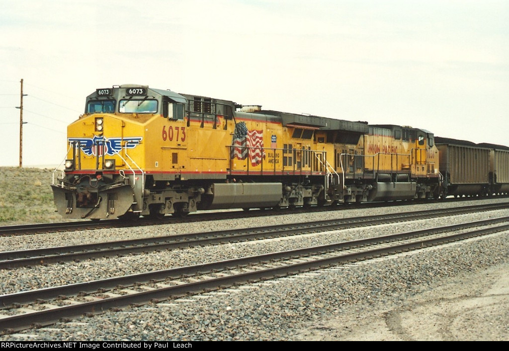 Loaded coal train rolls south